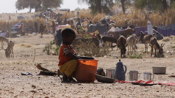 Child in Sudan sitting