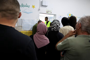 People cast ballots in the Arab town of Taibe in northern Israel during parliamentary elections. Ammar Awad/Reuters